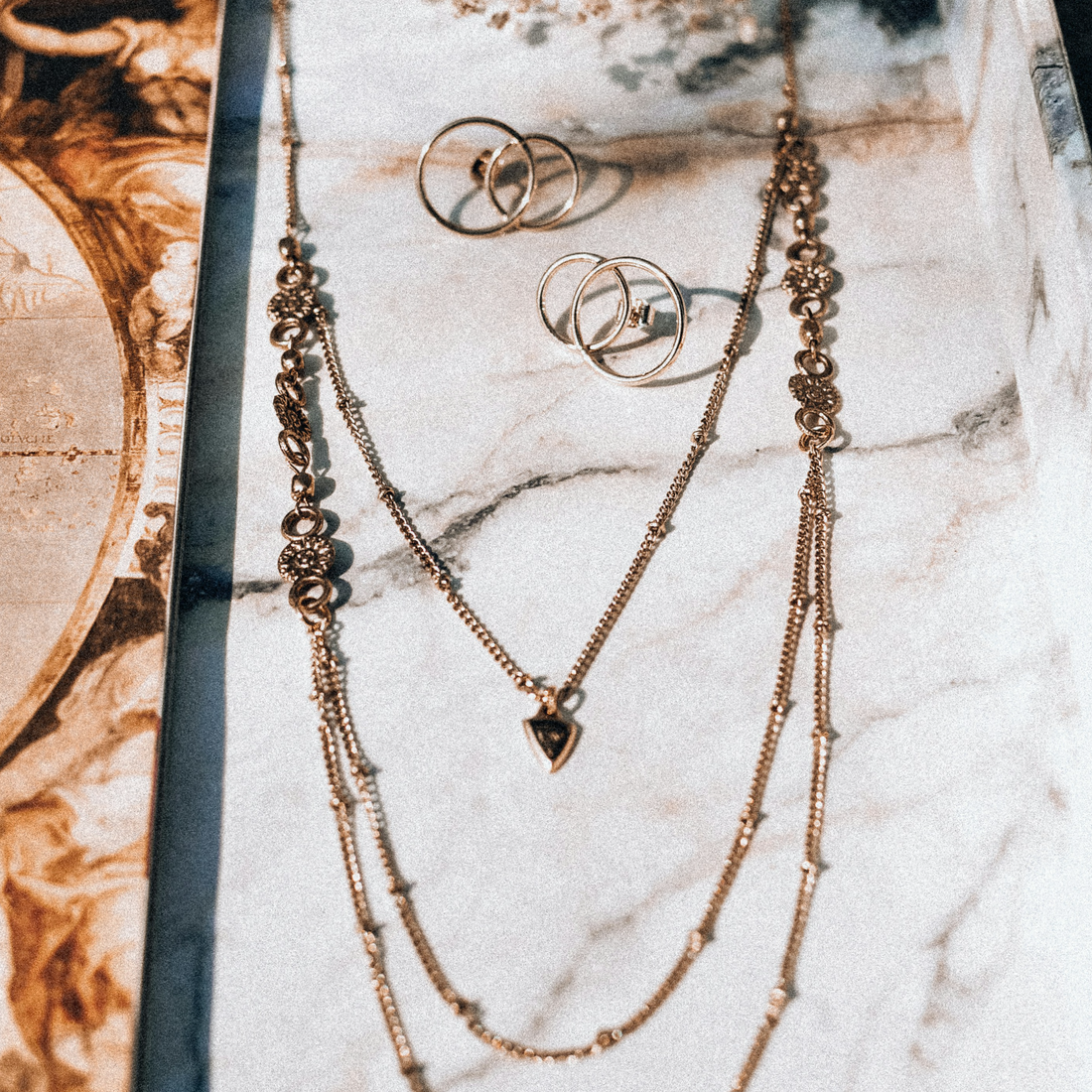 How To Layer Jewelry For Effortless Summer Style